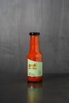 Bottle of Salsa Nostra sauce on grey background